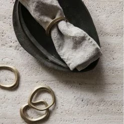 Ferm Living Flow Napkin Rings In Brass – Set Of 4 -Vitra Shop Ferm Living Flow Napkin Rings Lifestyle